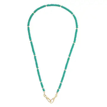 Turquoise beaded necklace with a gold clasp on a white background