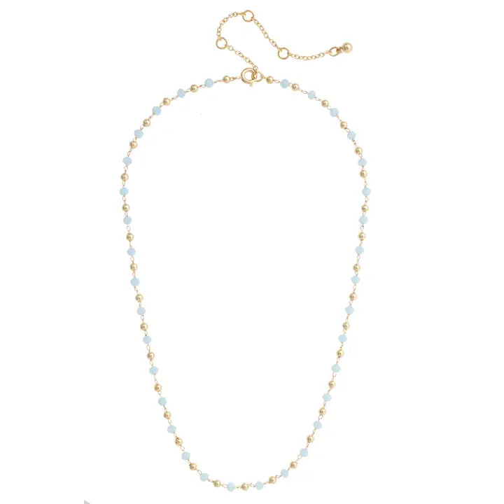 Delicate necklace with small beads alternating light blue to gold pattern on a white background.